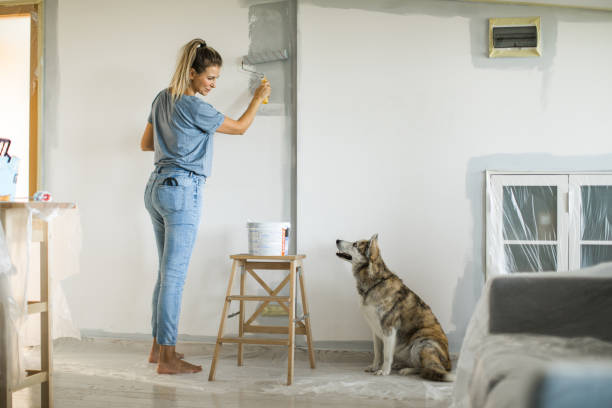 istock Woman doing diy project in apartment 1176604793