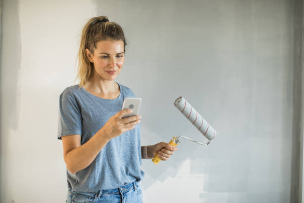 istock Woman doing diy project in apartment 1176604816