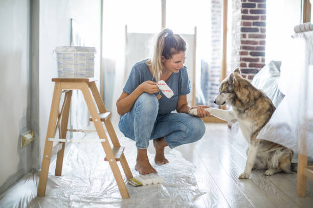 istock Woman doing diy project in apartment 1176604823