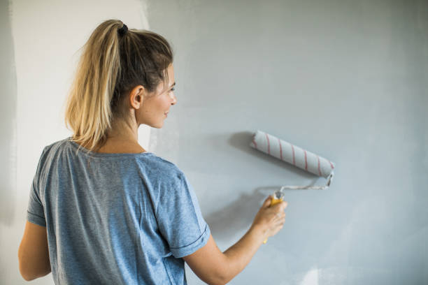 istock Woman doing diy project in apartment 1176604825
