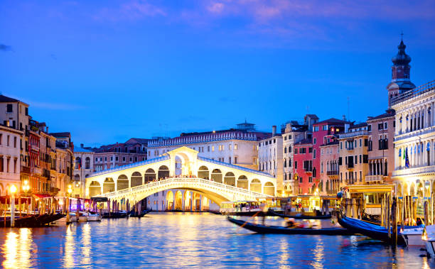 istock Rialto Bridge at sunset in Venice, Italy 1176605012