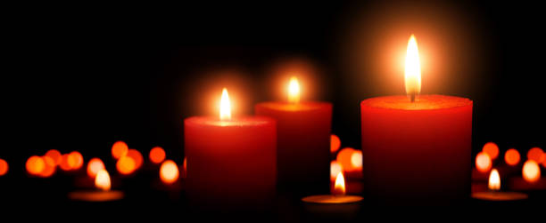 istock Advent candles, three flames in the foreground 1176605393