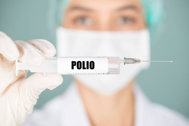 Polio Female nurse or doctor holding polio vaccination. polio virus photos stock pictures, royalty-free photos & images