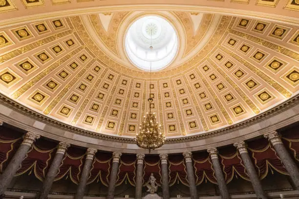 The Rotunda in the US Capitol Building at dusk.