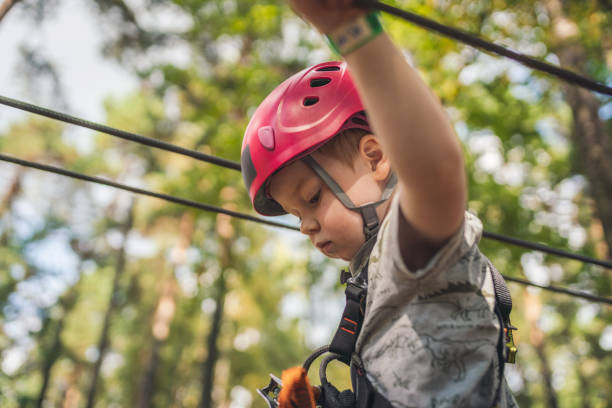 istock Cute little boy in an adventure park 1176606740