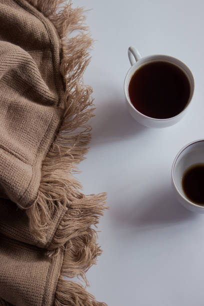 istock Cup of coffee on pastel plaid background. Flat lay, top view 1176607385