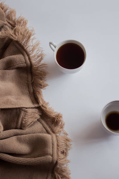 istock Cup of coffee on pastel plaid background. Flat lay, top view 1176607502