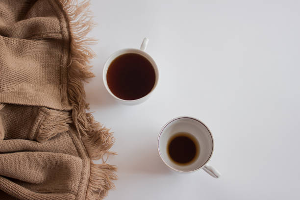 istock Cup of coffee on pastel plaid background. Flat lay, top view 1176607514