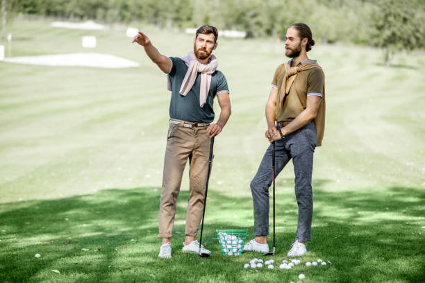 istock Male friends on a golf course 1176608629