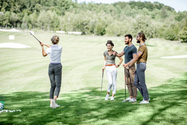 istock People playing golf outoors 1176608760