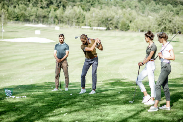 istock People playing golf outoors 1176608795