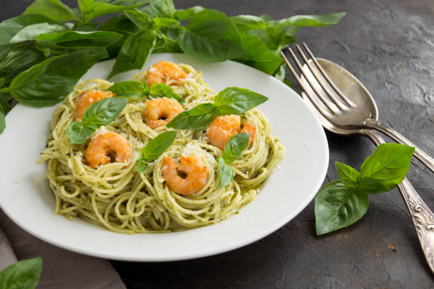 istock traditional Italian dish. pasta with pesto. on dark background. 1176609853