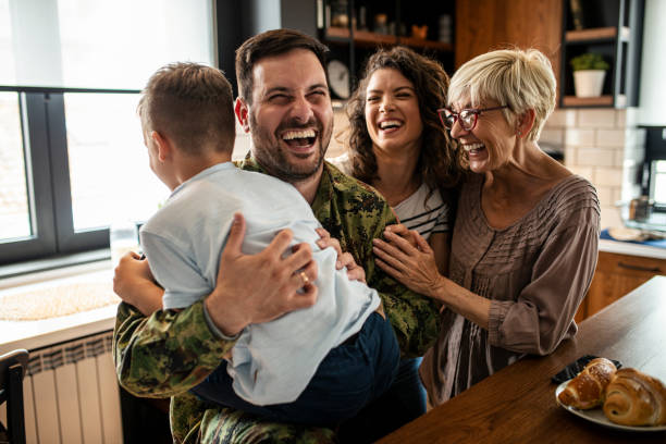 American soldier finally at home with his family American soldier finally at home with his family family reunion stock pictures, royalty-free photos & images