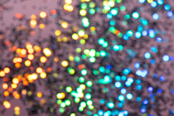 istock Colorful prism confetti blurred festive backdrop, trendy sparkles and glitter background, flat lay style. Christmas and holidays concept 1176610840