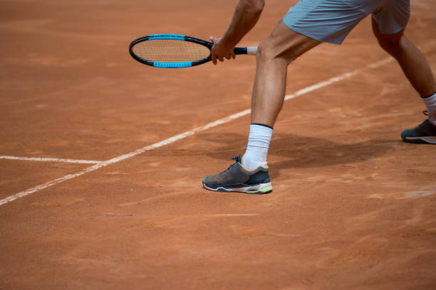 istock Low section of tennis player waiting for return 1176611077
