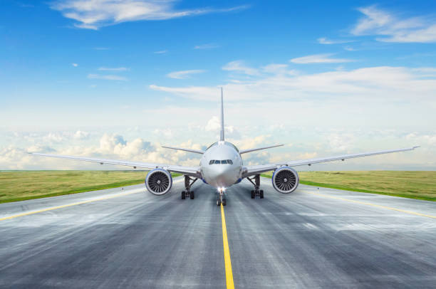 Taxiing passenger commercial airplane to the runway. Taxiing passenger commercial airplane to the runway at the bottom of photos stock pictures, royalty-free photos & images