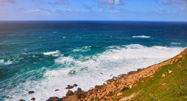 istock Cabo da Roca, Portugal. Lighthouse and cliffs over Atlantic Ocean, the most westerly point of the European mainland. 1176612537