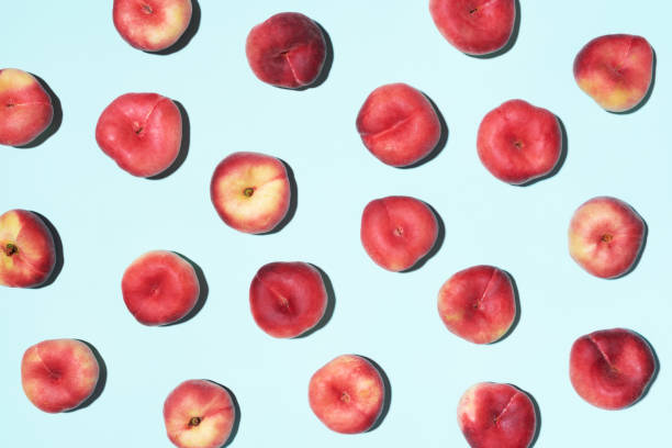 istock Peaches pattern on pastel blue background. Frame made of fresh fruits. Flat lay, top view, copy space. Vegan and vegetarian diet 1176612923