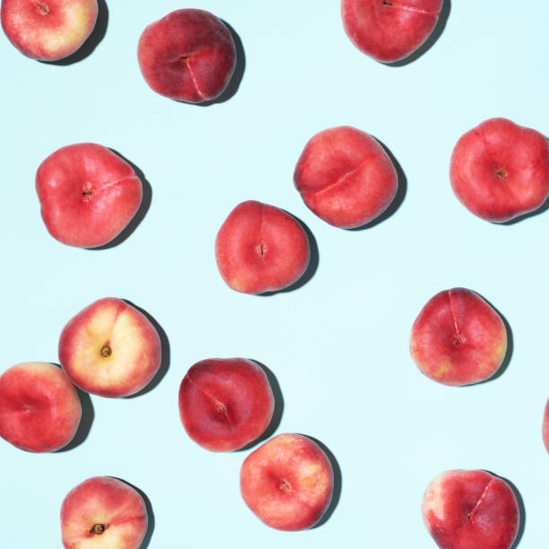 istock Peaches pattern on pastel blue background. Frame made of fresh fruits. Flat lay, top view, copy space. Vegan and vegetarian diet 1176612930