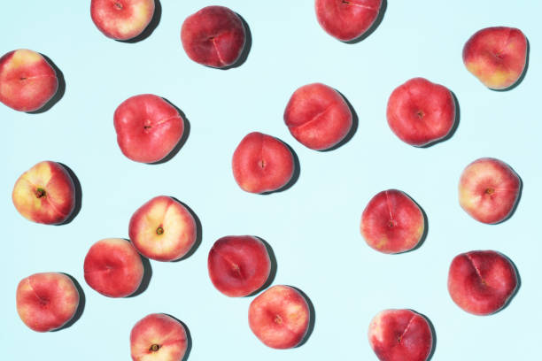 istock Peaches pattern on pastel blue background. Frame made of fresh fruits. Flat lay, top view, copy space. Vegan and vegetarian diet 1176612933