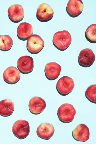 istock Peaches pattern on pastel blue background. Frame made of fresh fruits. Flat lay, top view, copy space. Vegan and vegetarian diet 1176612938