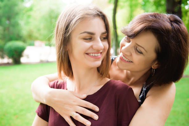 istock Cute young daughter embracing her mother with love. 1176612986