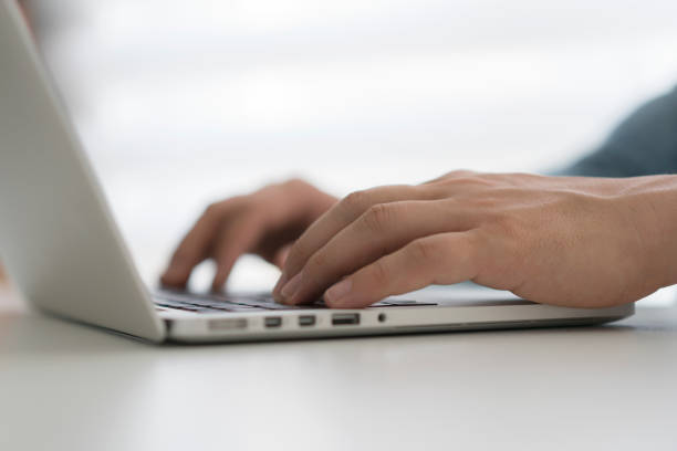 istock Man typing on laptop, close up 1176614012