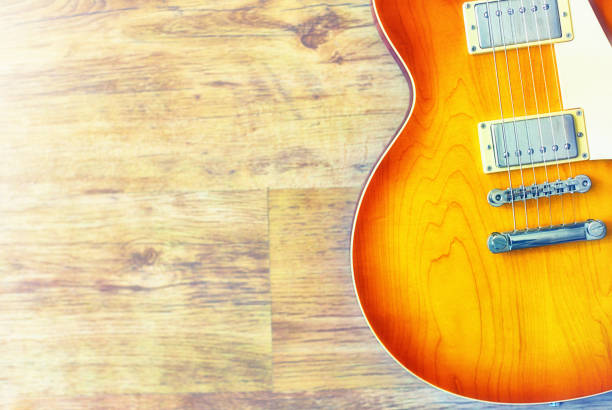 istock Electric guitar against wood grain 1176614534
