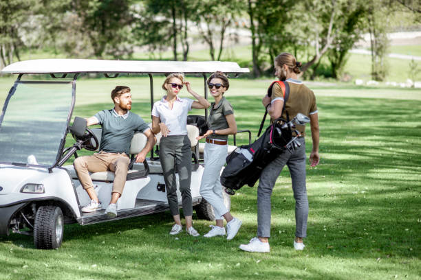 istock People near the golf car on the playing course 1176615458