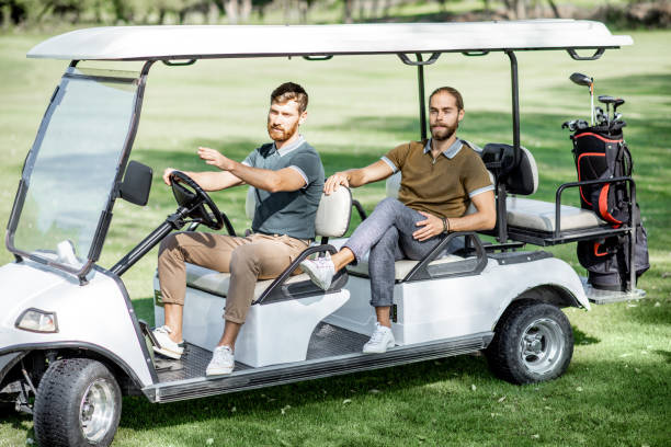 istock Friends driving golf car 1176615636
