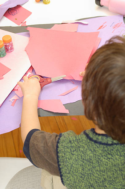 istock Over the shoulder view of child doing crafts 117661565