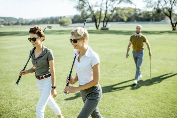 istock Woman walking on a golf course 1176615729