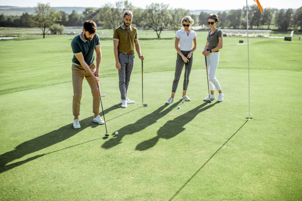 istock People playing golf outdoors 1176615765