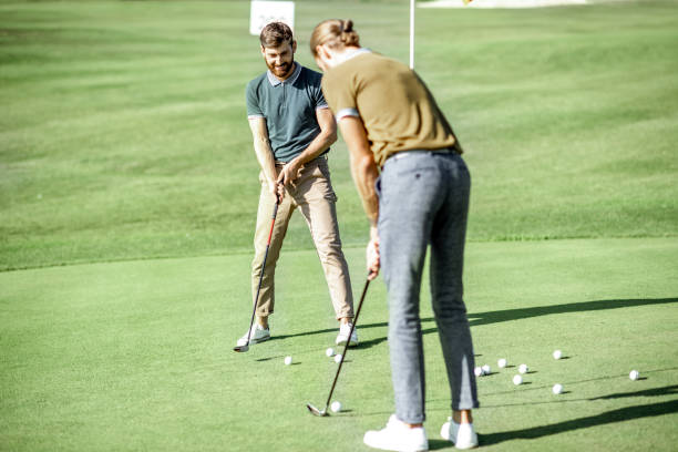 istock Men playing golf outdoors 1176615940