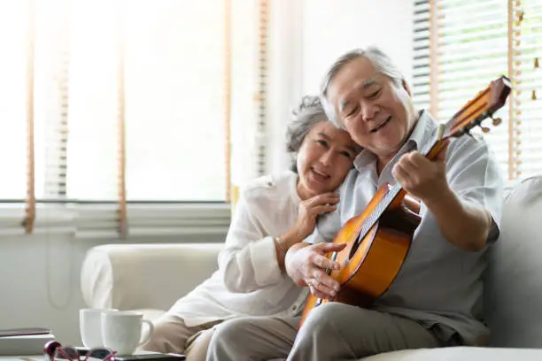 Photo of Happy Asian senior Couple enjoying.