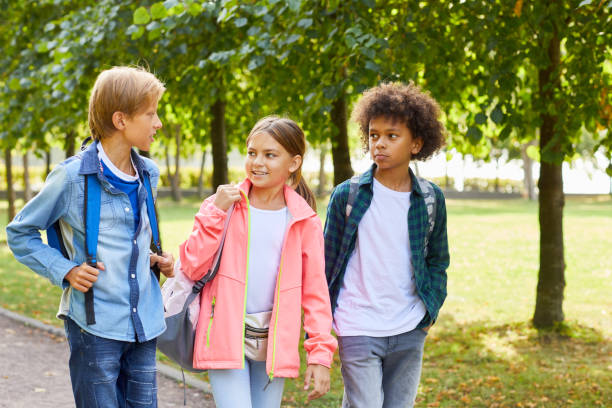 istock Children walking in the park 1176620747
