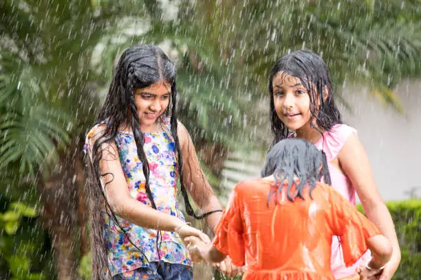 Photo of Girls enjoying rain