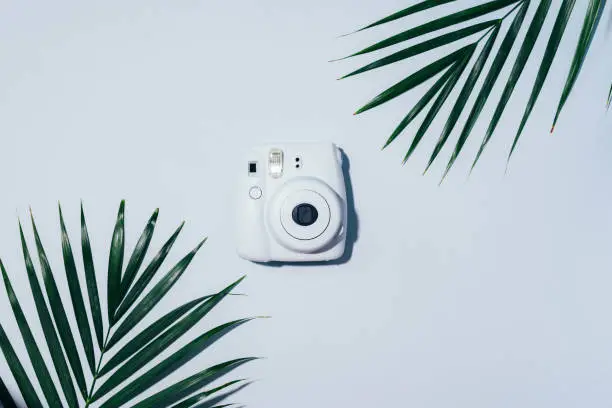 Vilnius, Lithuania - September 16, 2019: FUJIFILM INSTAX Mini Instant Film Camera on grey background