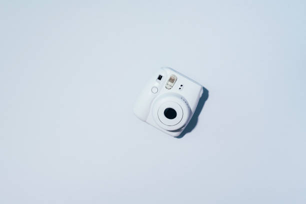 istock Vilnius, Lithuania - September 16, 2019: FUJIFILM INSTAX Mini Instant Film Camera on grey background. 1176621376