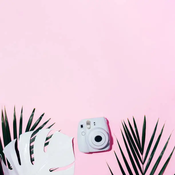 Vilnius, Lithuania - September 16, 2019: FUJIFILM INSTAX Mini Instant Film Camera on pink background