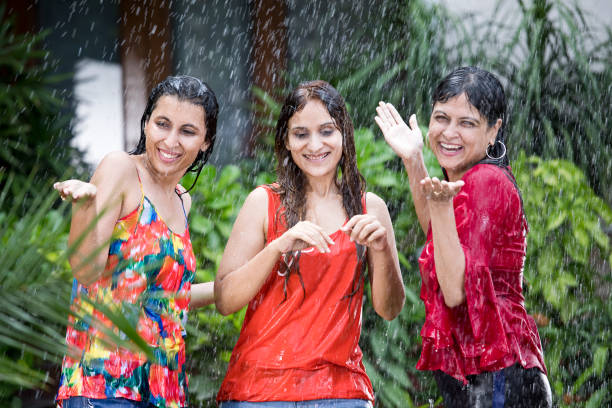 istock Three women enjoying rain 1176621413