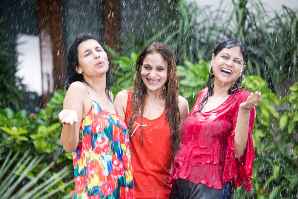 istock Three women enjoying rain 1176621447