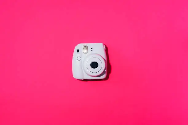 Vilnius, Lithuania - September 16, 2019: FUJIFILM INSTAX Mini Instant Film Camera on grey background