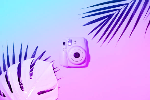 istock Vilnius, Lithuania - September 16, 2019: FUJIFILM INSTAX Mini Instant Film Camera on neon gradient background. 1176621516