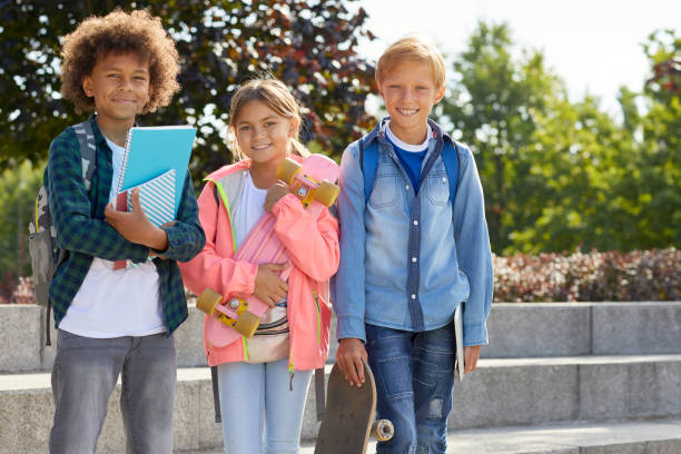 istock Happy children standing outdoors 1176621545