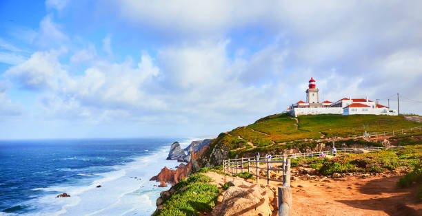 istock Cabo da Roca, Portugal. Lighthouse and cliffs over Atlantic Ocean, the most westerly point of the European mainland. 1176621648