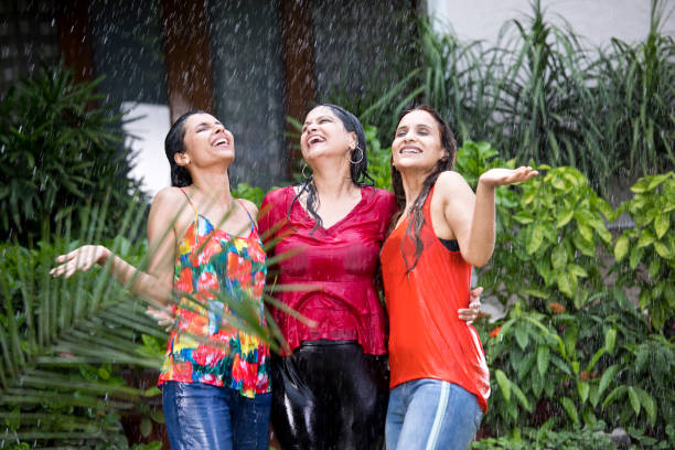 istock Three women enjoying rain 1176621692