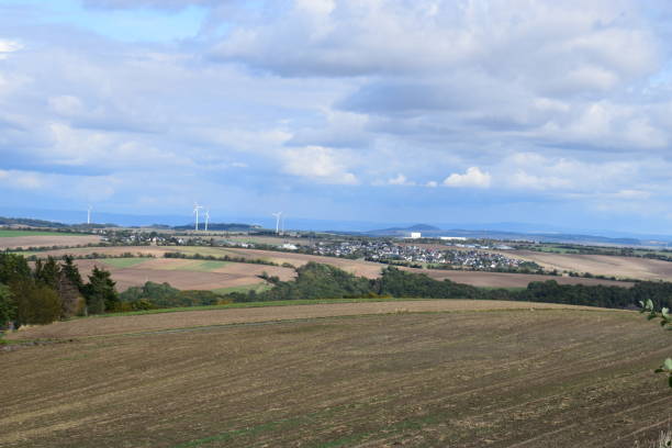 istock wide Eifel landscape with wind turbines 1176622511