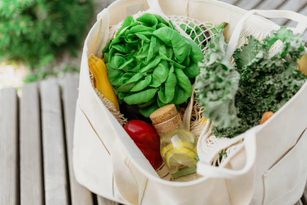 istock Eco friendly mesh bag with organic green vegetables. Flat lay, top view. Zero waste, plastic free concept. Healthy clean eating diet and detox. 1176623024