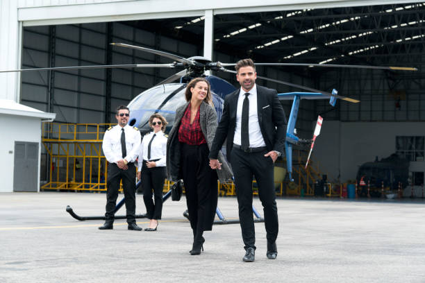 istock Couple getting off their helicopter 1176625315